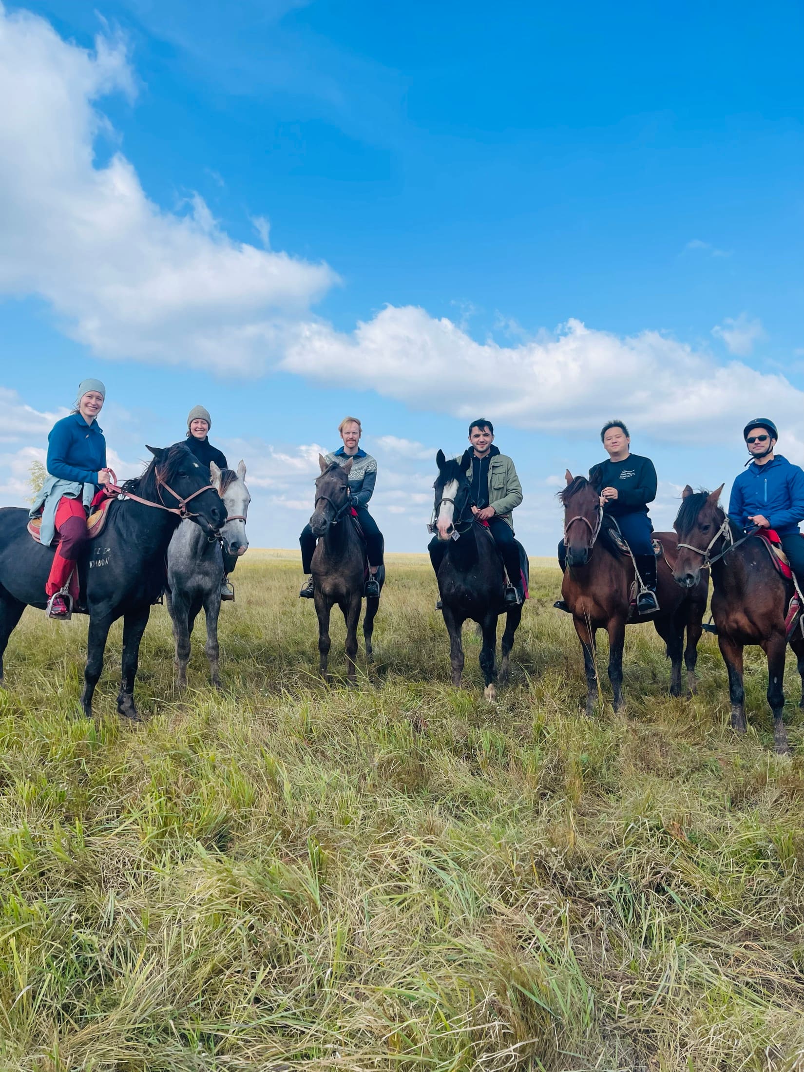 Riders on horseback across the Kazakh steppe